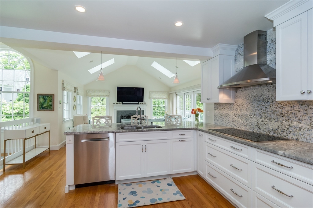 27 Appleby Road Wellesley, MA 02482 - Photo 5 of 23 a kitchen with a sink stove and cabinets