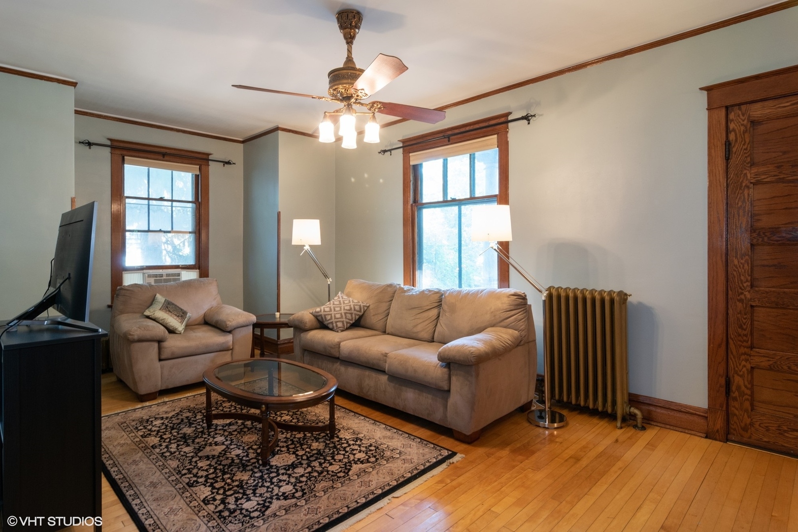 4132 Prairie Avenue Brookfield, IL 60513 - Photo 2 of 10 a living room with furniture two lamps and a fireplace