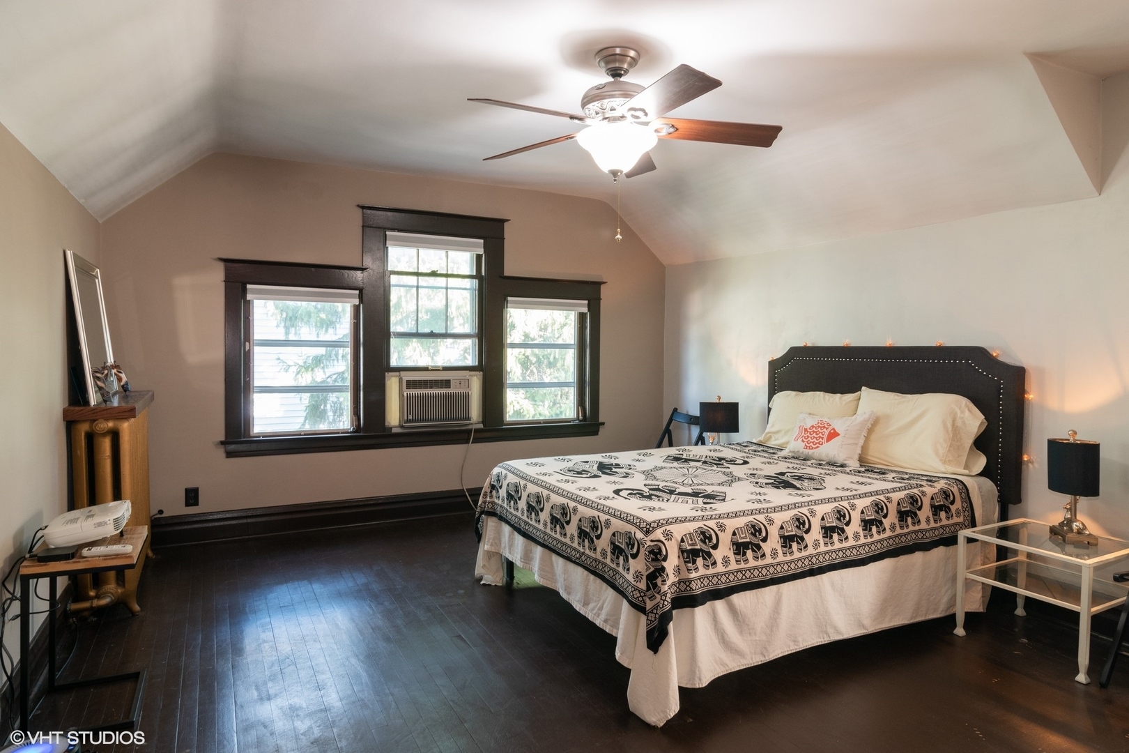 4132 Prairie Avenue Brookfield, IL 60513 - Photo 5 of 10 a bedroom with a bed chandelier and a window