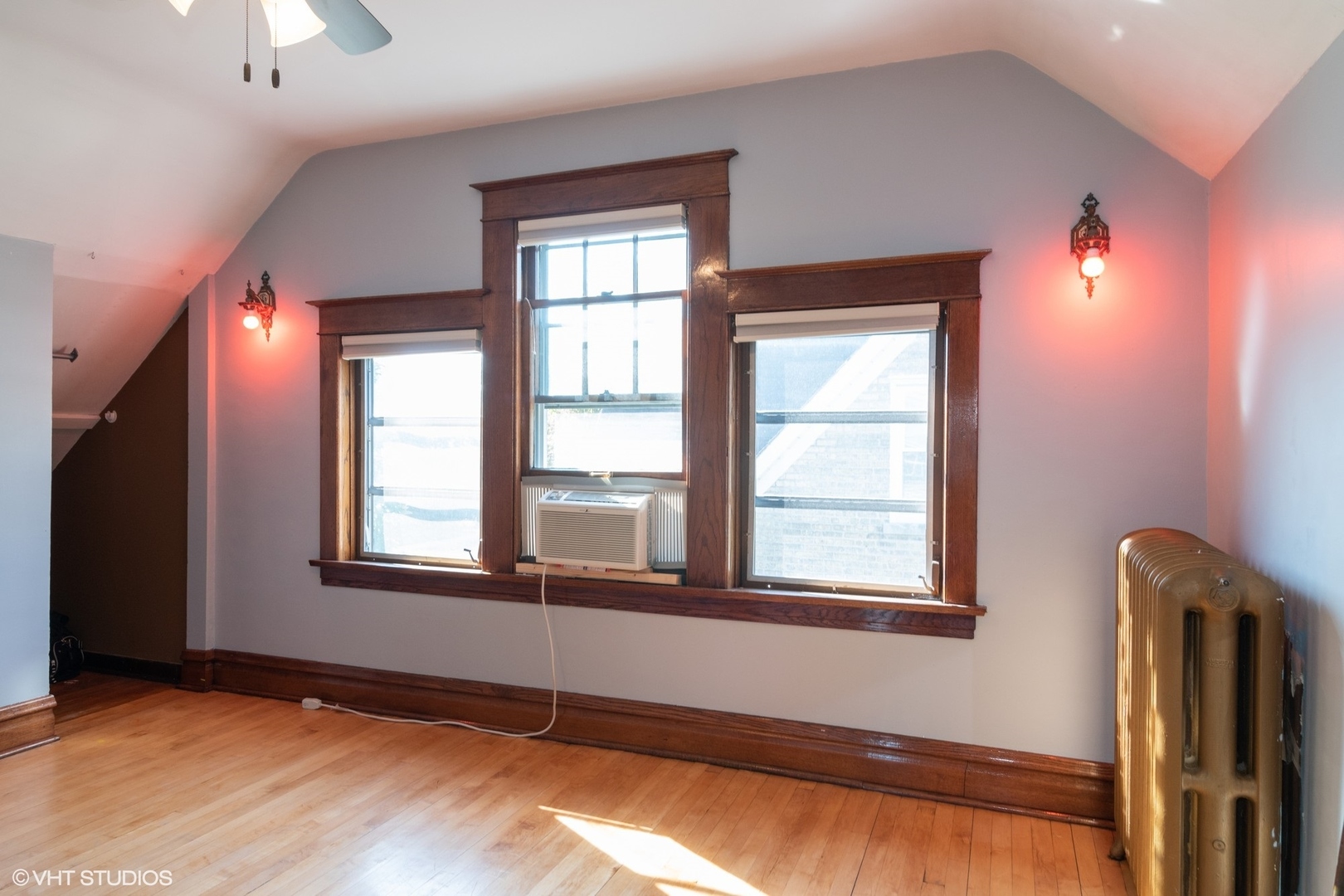 4132 Prairie Avenue Brookfield, IL 60513 - Photo 6 of 10 a view of an empty room with a window and wooden floor