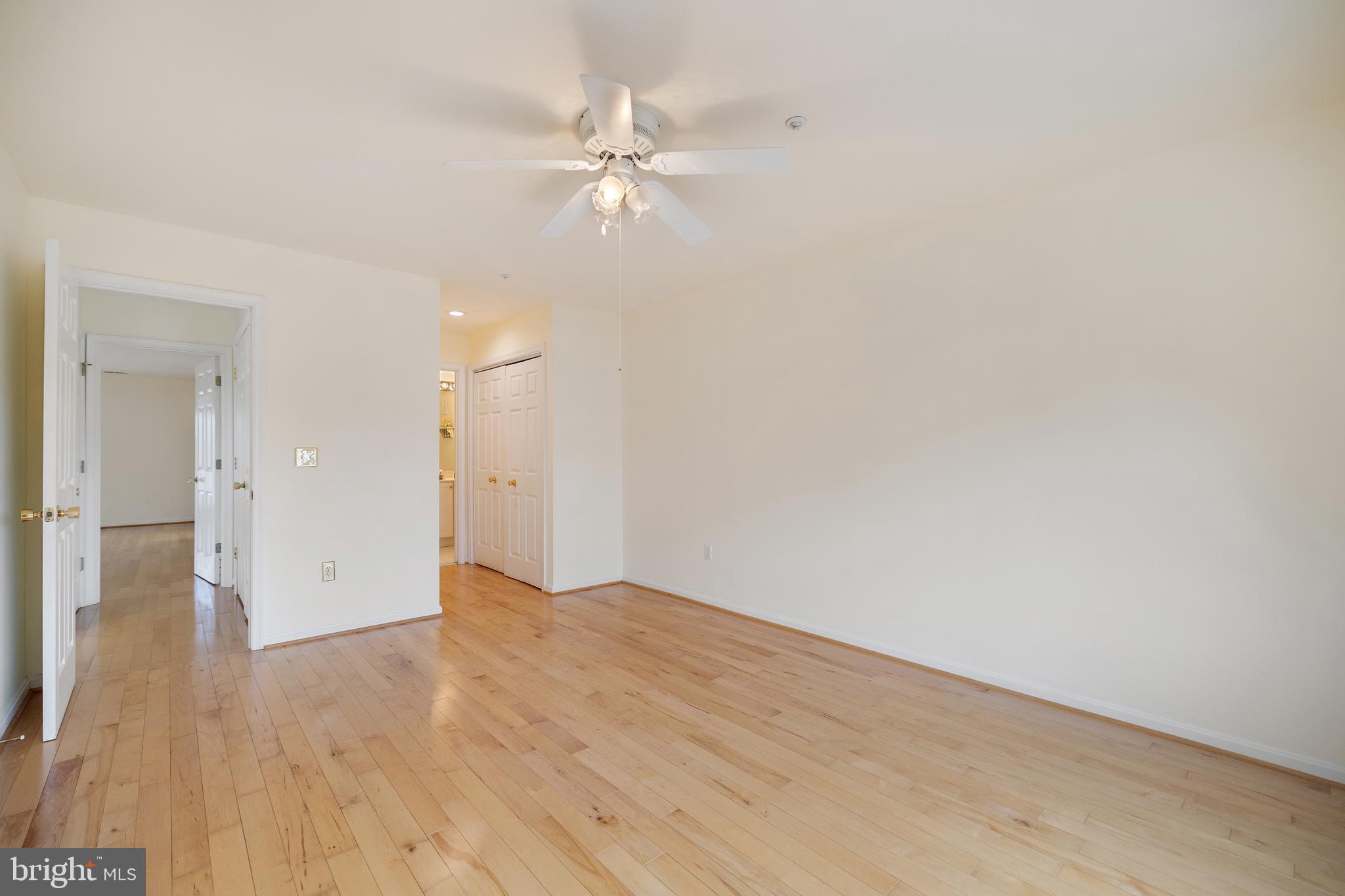 807 Auckland Way Chester, MD 21619 - Photo 22 of 47 a view of an empty room and wooden floor