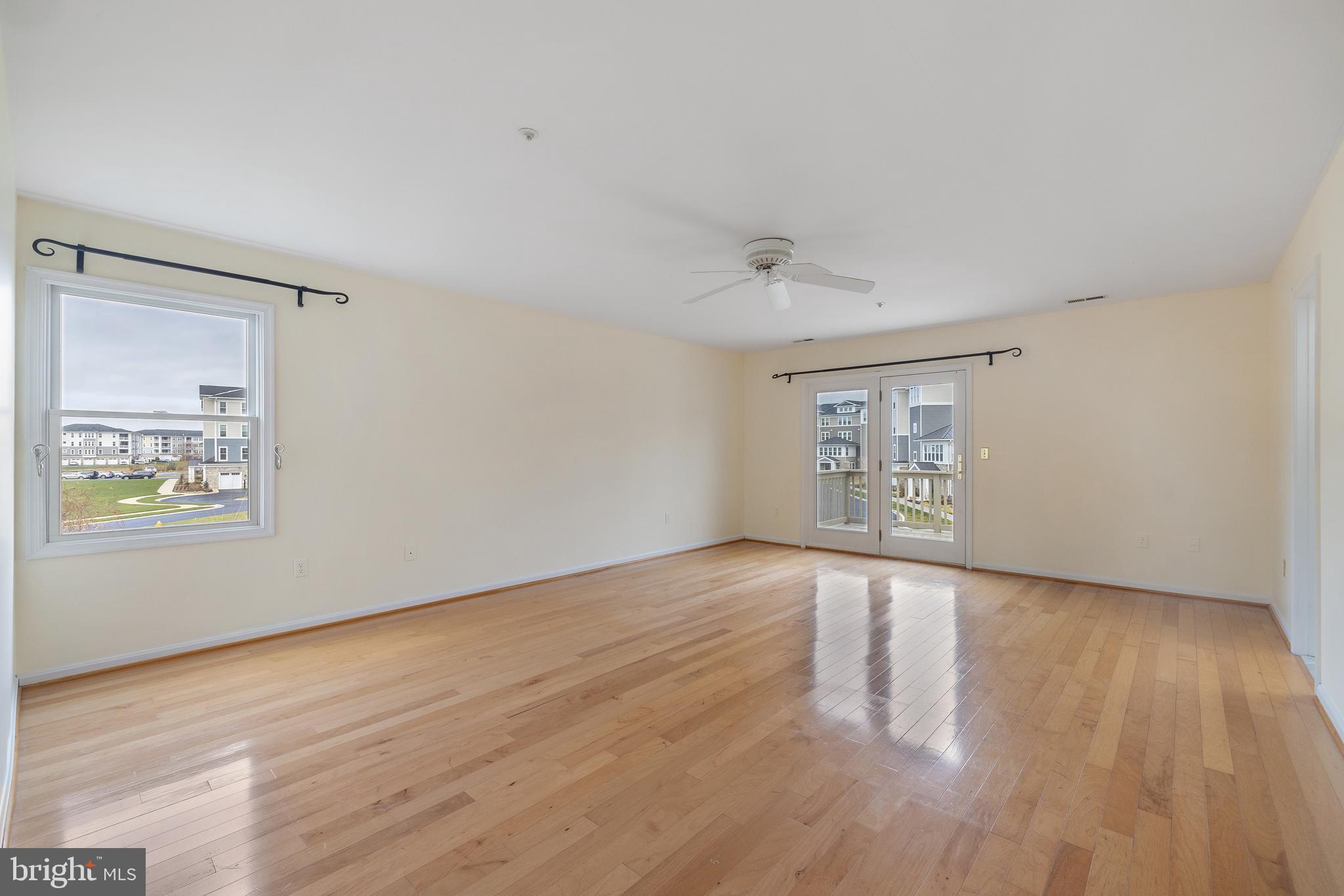 807 Auckland Way Chester, MD 21619 - Photo 25 of 47 a view of an empty room with wooden floor and a window