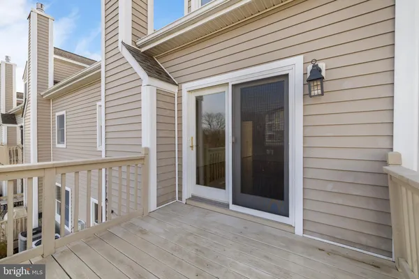 a view of a house with a yard and tree s