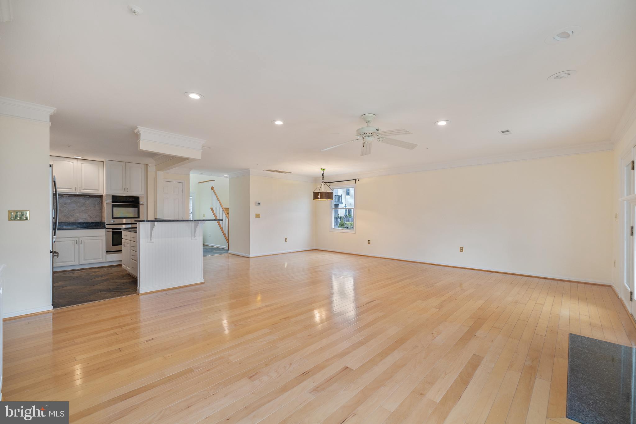 807 Auckland Way Chester, MD 21619 - Photo 10 of 47 a view of a kitchen with a refrigerator and a stove top oven