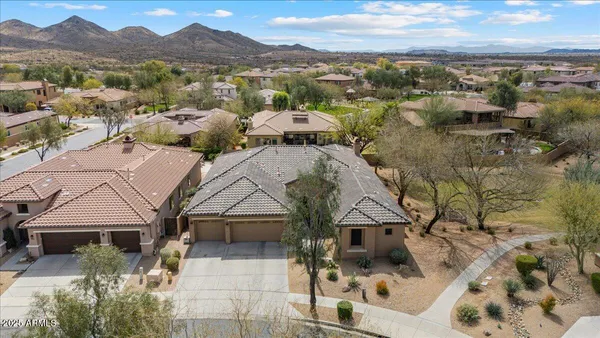 a view of a town with mountains in the background