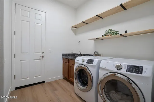 a view of washer and dryer in a utility room