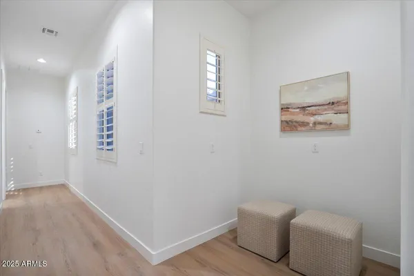 a view of room with window and wooden floor
