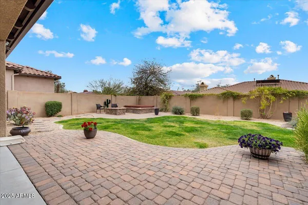 a view of a backyard with sitting area