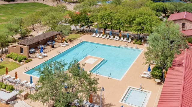a view of a water with a floor to ceiling window and a yard