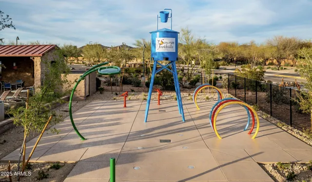 a view of a swimming pool with a table and chairs