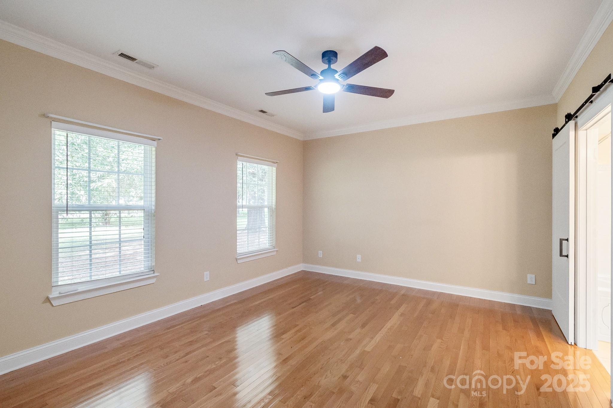 13221 Brandywine Lane Midland, NC 28107 - Photo 12 of 34 wooden floor in an empty room with a window