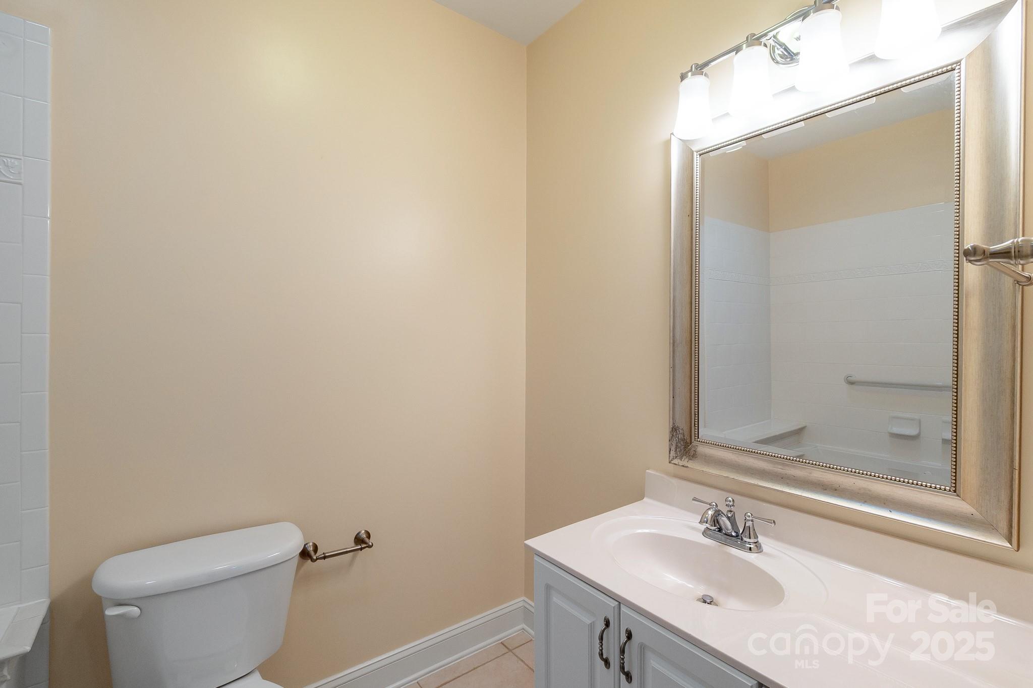 13221 Brandywine Lane Midland, NC 28107 - Photo 15 of 34 a bathroom with a sink toilet and shower