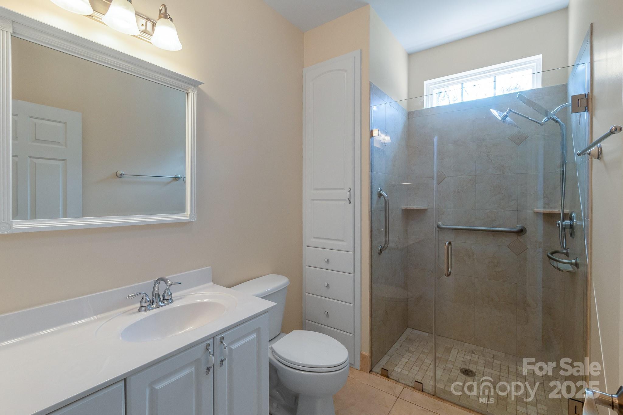13221 Brandywine Lane Midland, NC 28107 - Photo 18 of 34 a bathroom with a granite countertop sink toilet and shower