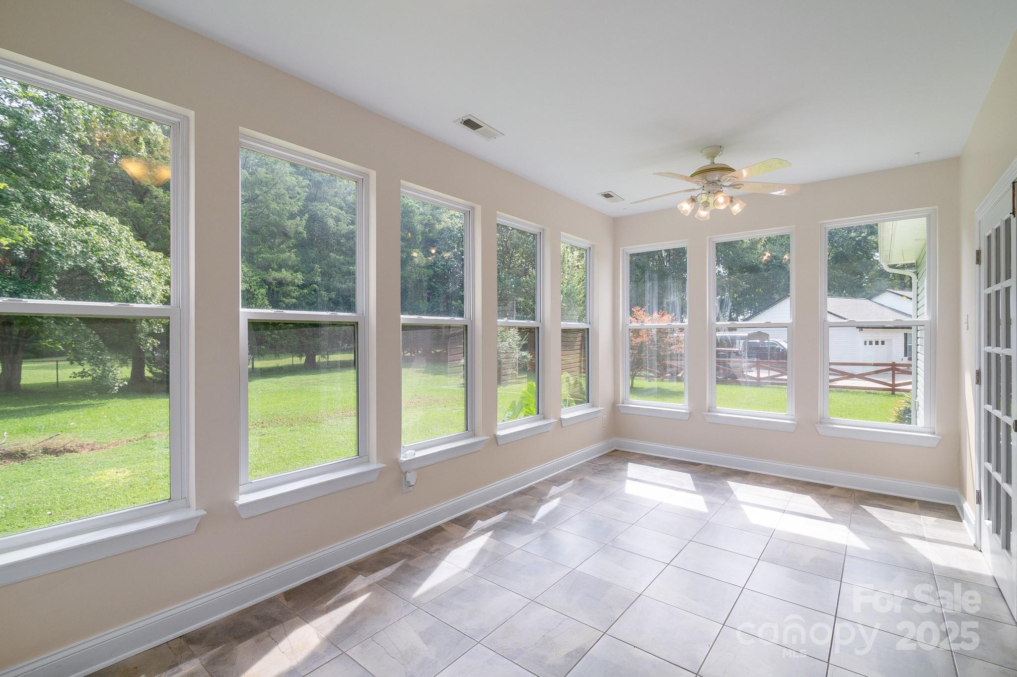 13221 Brandywine Lane Midland, NC 28107 - Photo 26 of 34 a view of an empty room with windows and pool in the room