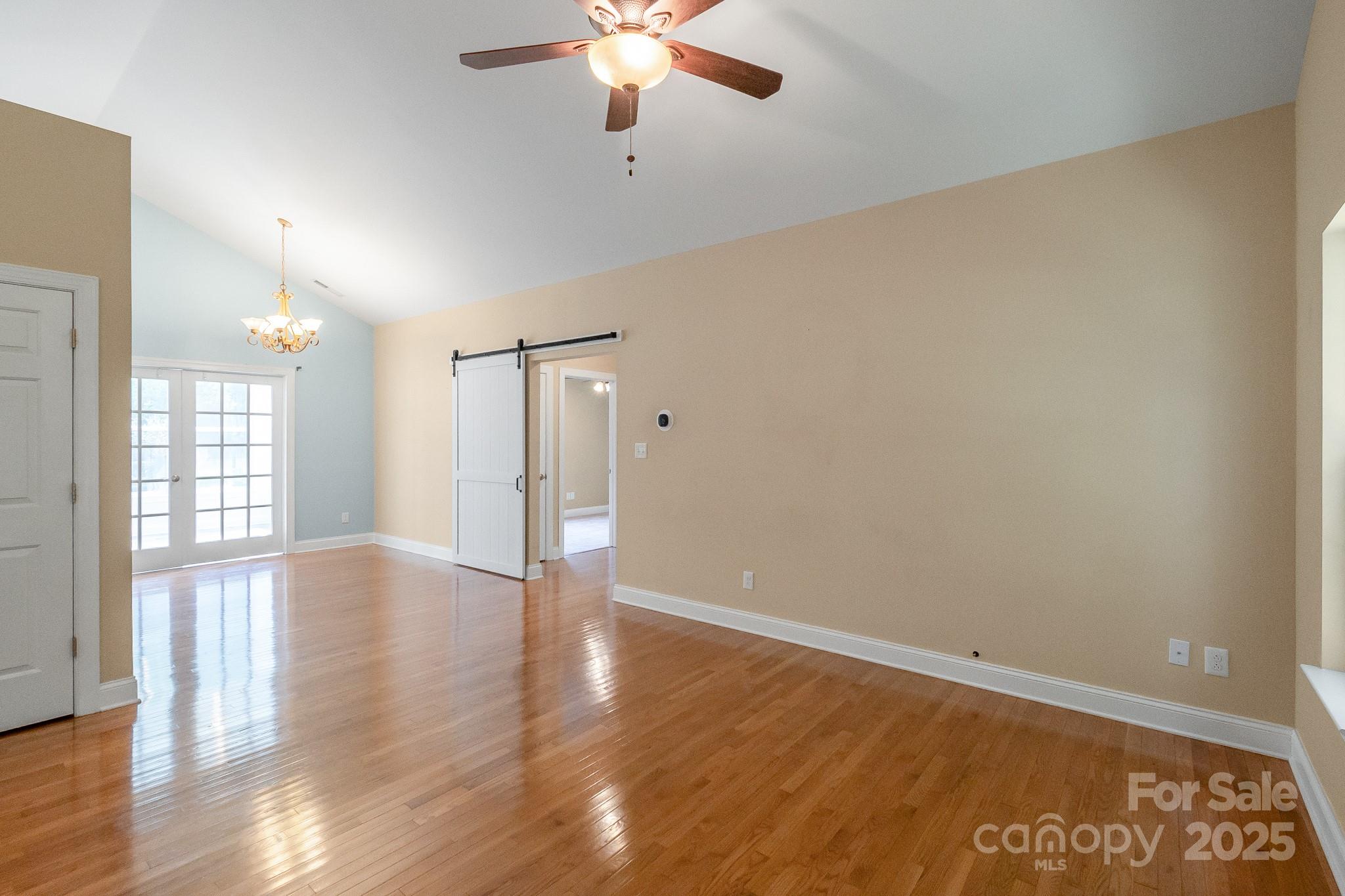 13221 Brandywine Lane Midland, NC 28107 - Photo 3 of 34 wooden floor in an empty room with a window