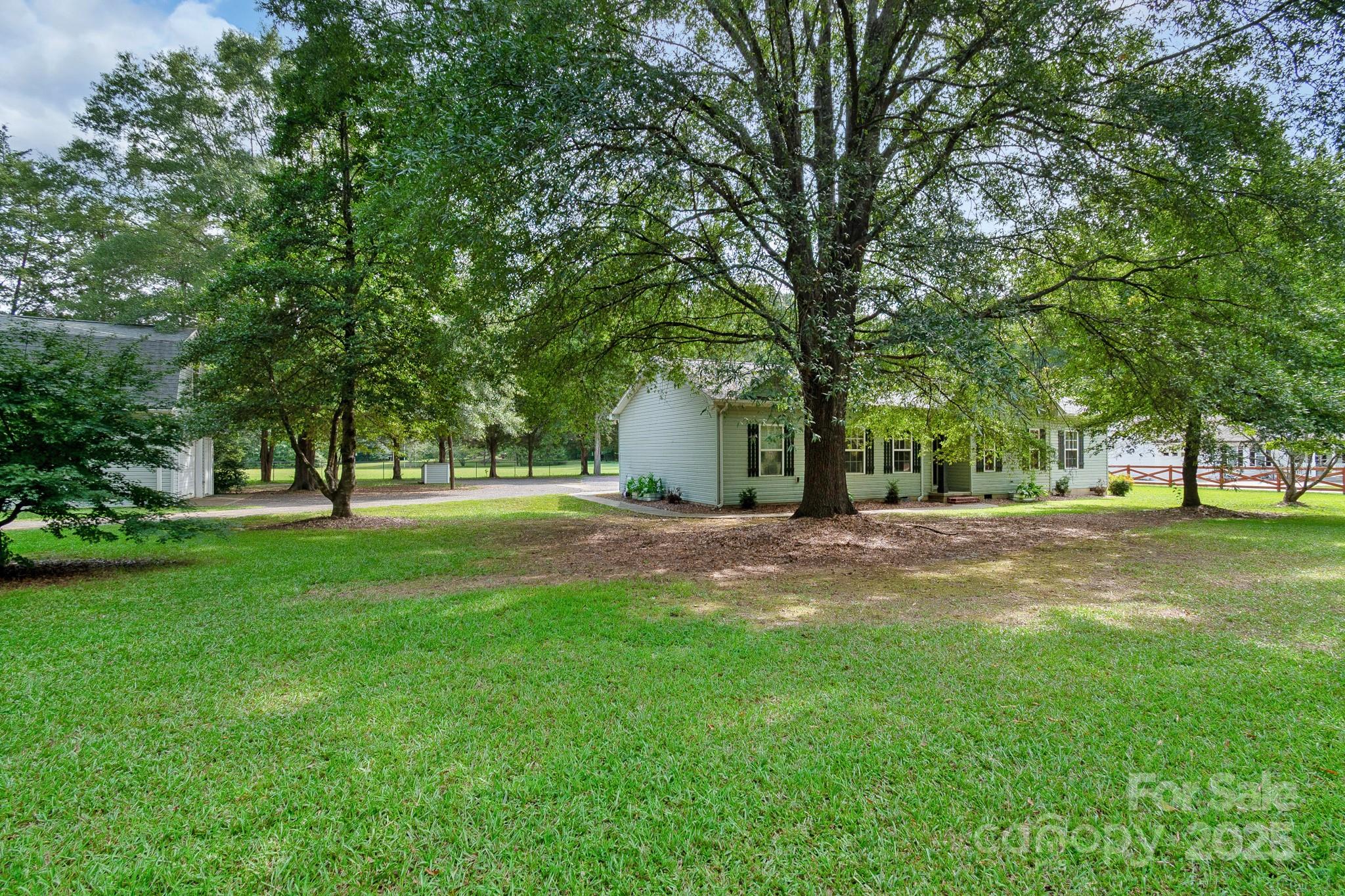 13221 Brandywine Lane Midland, NC 28107 - Photo 31 of 34 a view of a house with a yard and tree s