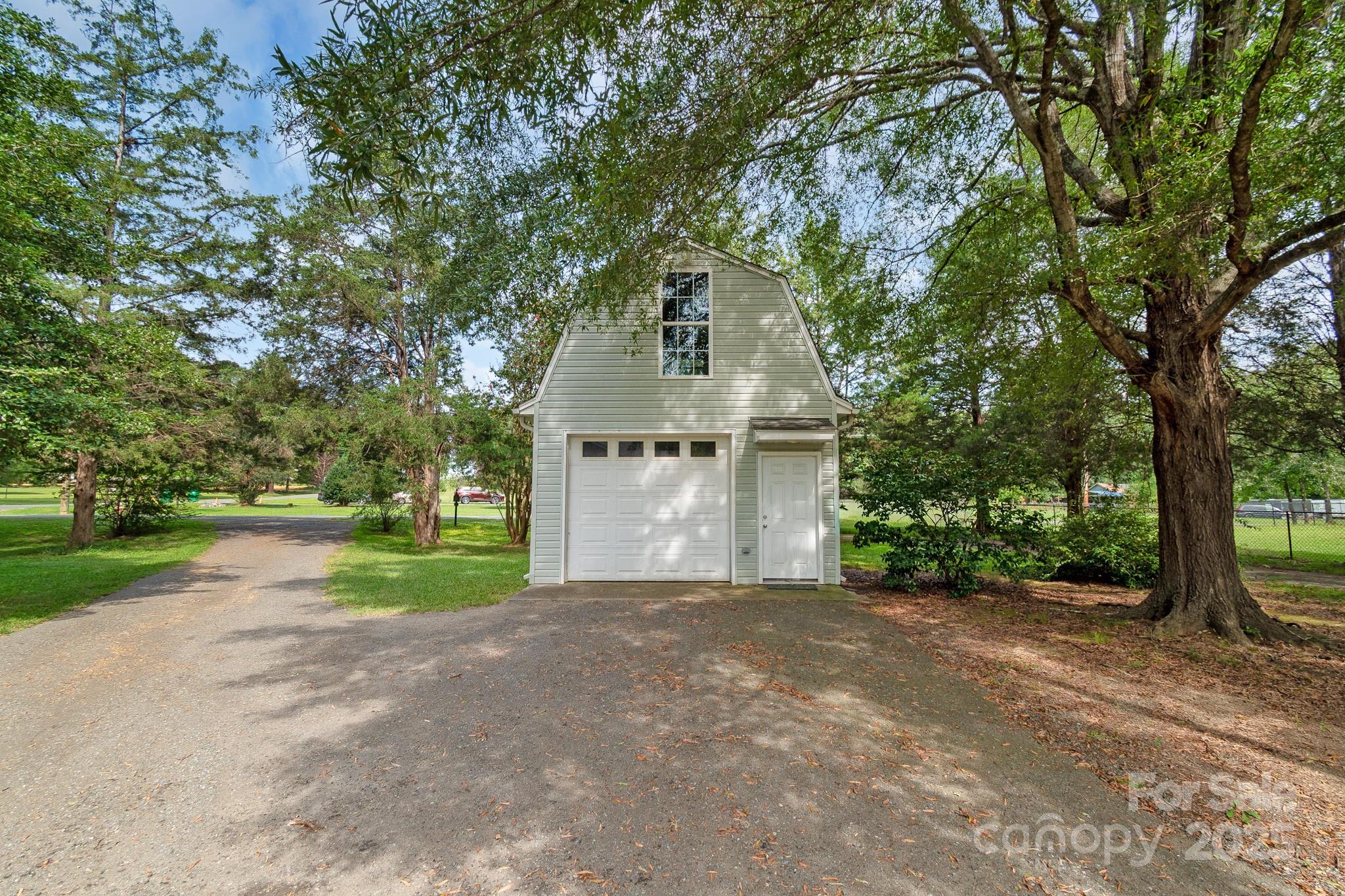 13221 Brandywine Lane Midland, NC 28107 - Photo 32 of 34 a front view of a house with yard and tree