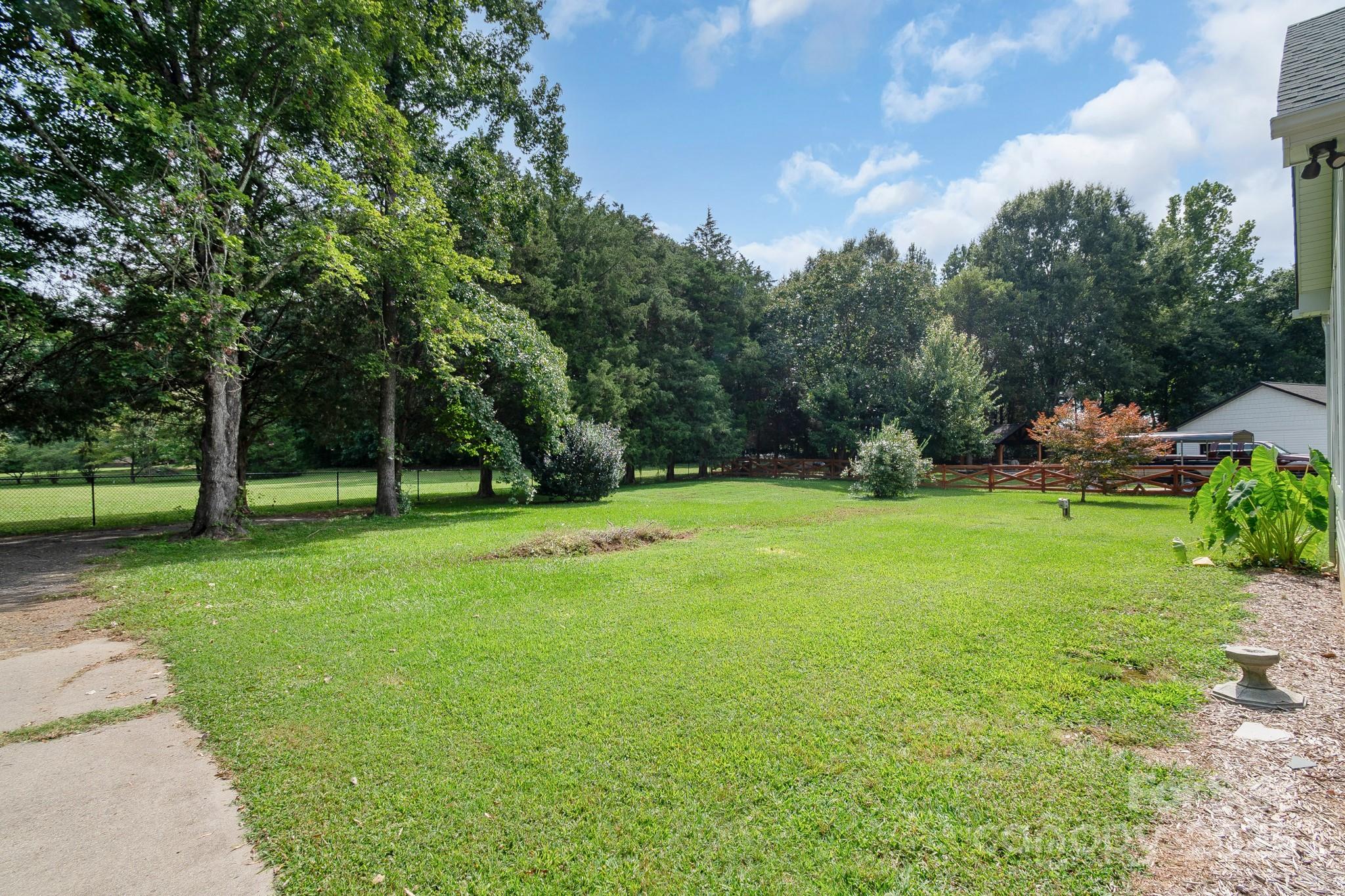 13221 Brandywine Lane Midland, NC 28107 - Photo 33 of 34 a view of a park with trees in the background