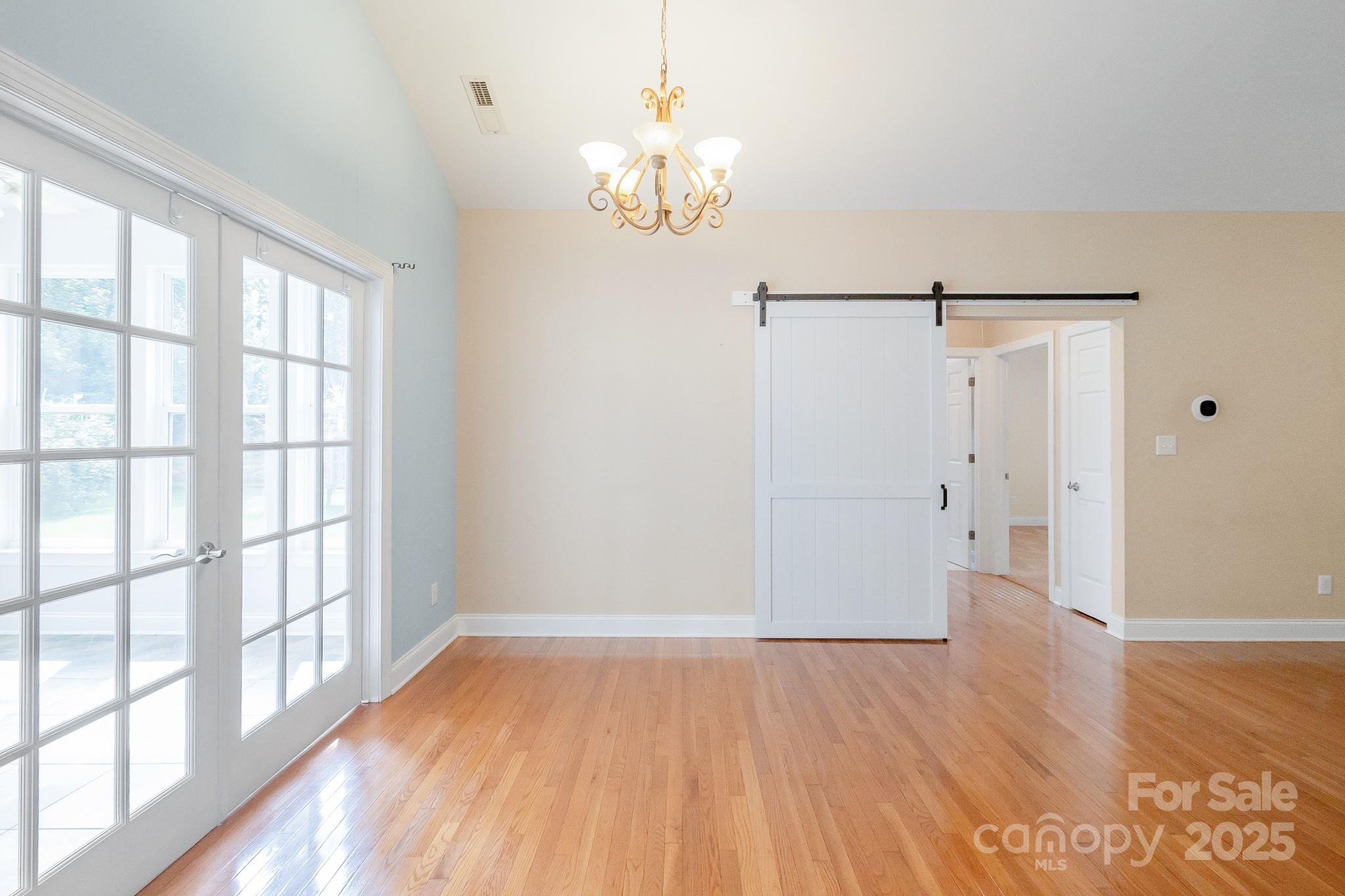 13221 Brandywine Lane Midland, NC 28107 - Photo 7 of 34 wooden floor in an empty room with a window