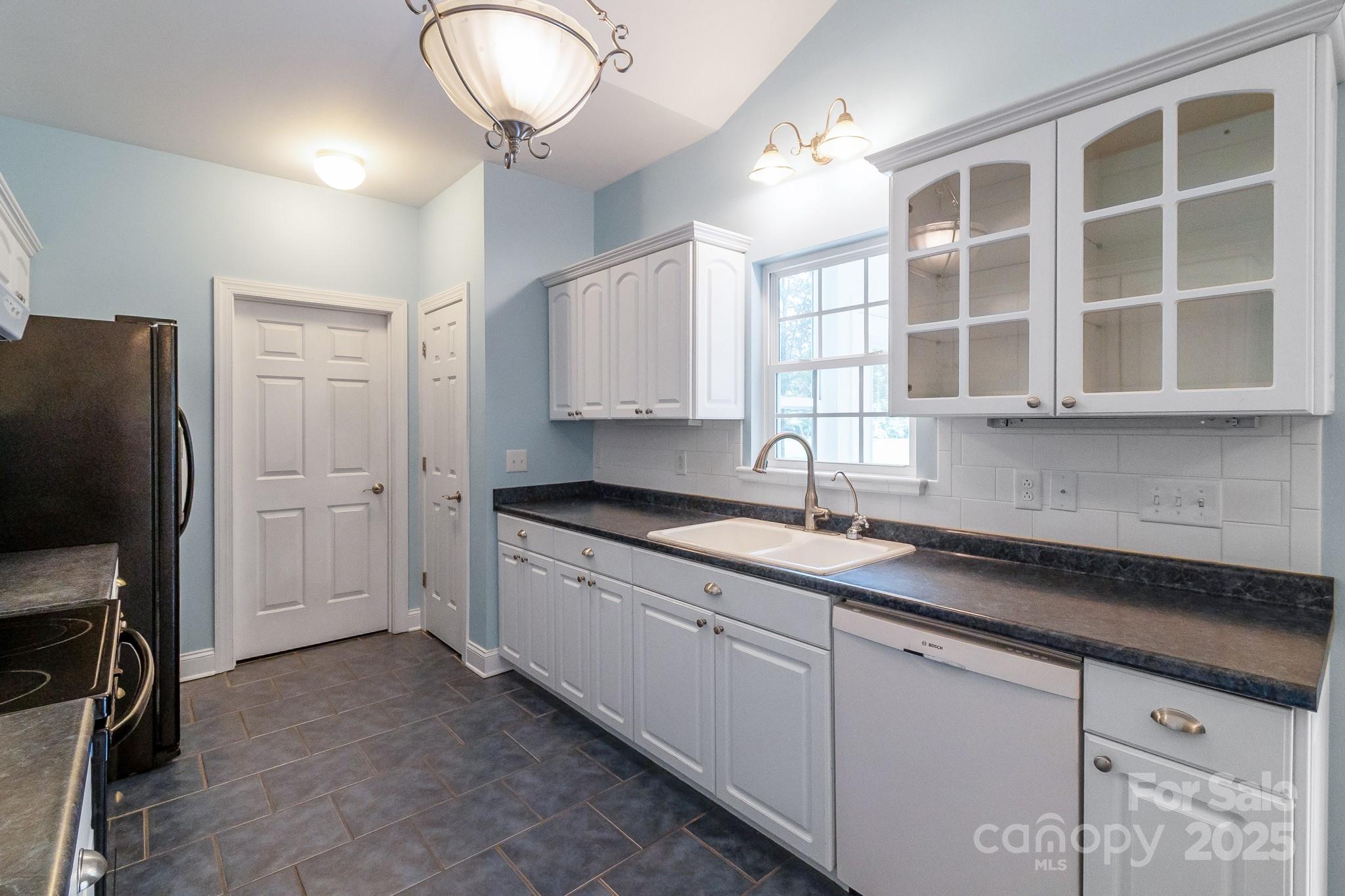 13221 Brandywine Lane Midland, NC 28107 - Photo 10 of 34 a kitchen with stainless steel appliances granite countertop a sink and cabinets