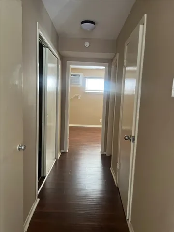 a view of gallery with wooden floor