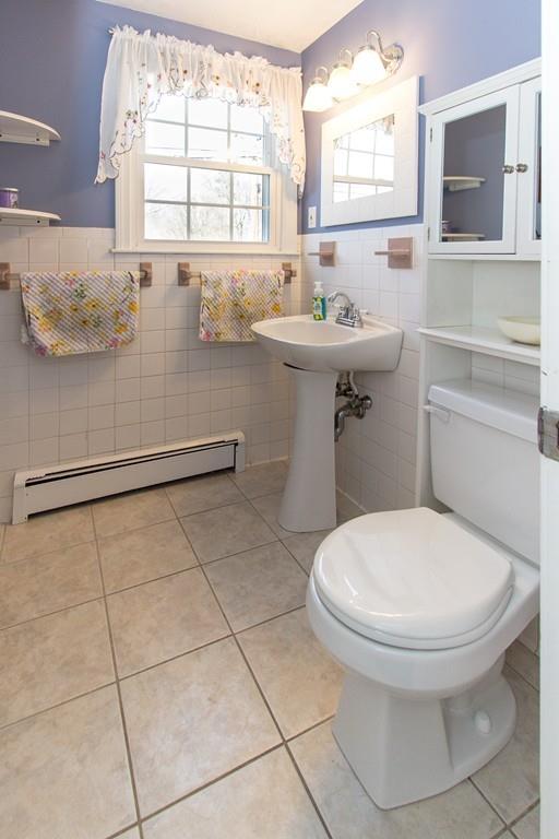 59 Warren Road Framingham, MA 01702 - Photo 11 of 25 a bathroom with a sink toilet and window
