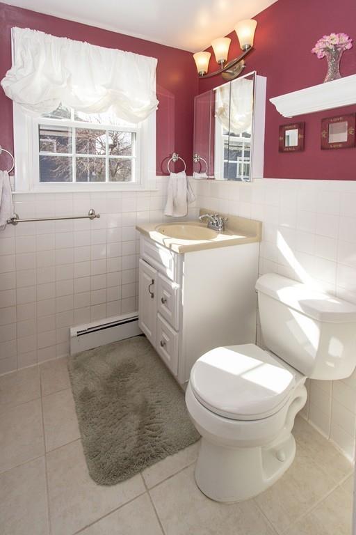 59 Warren Road Framingham, MA 01702 - Photo 16 of 25 a bathroom with a granite countertop toilet sink and mirror