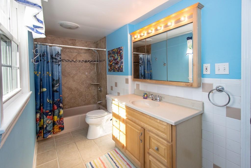 59 Warren Road Framingham, MA 01702 - Photo 20 of 25 a bathroom with a sink toilet and shower