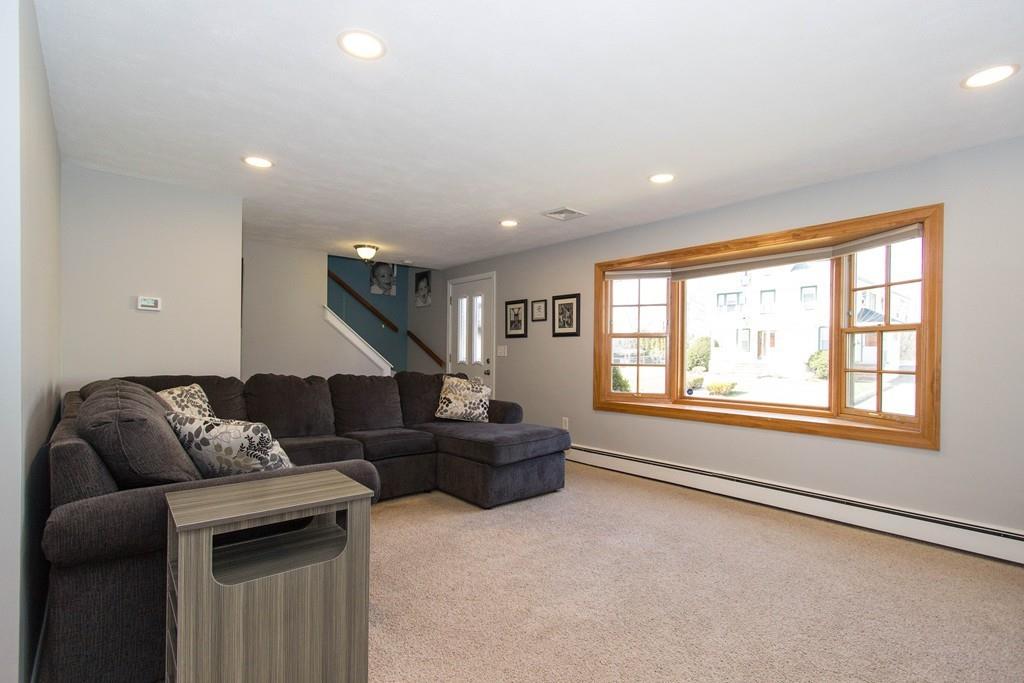 59 Warren Road Framingham, MA 01702 - Photo 2 of 25 a living room with furniture and a large window
