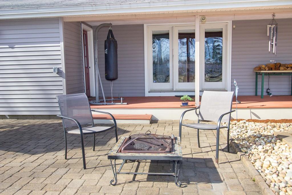 59 Warren Road Framingham, MA 01702 - Photo 24 of 25 a front view of a house with outdoor seating