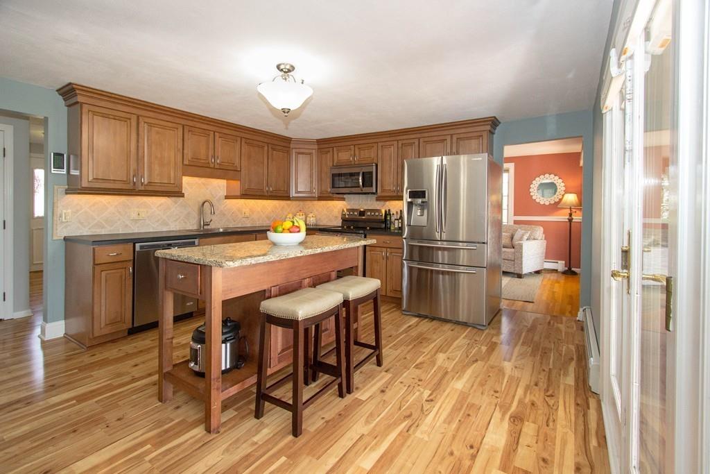 59 Warren Road Framingham, MA 01702 - Photo 4 of 25 a kitchen with granite countertop stainless steel appliances a sink and counter space