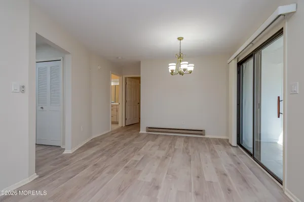 a bathroom with a granite countertop toilet and a sink