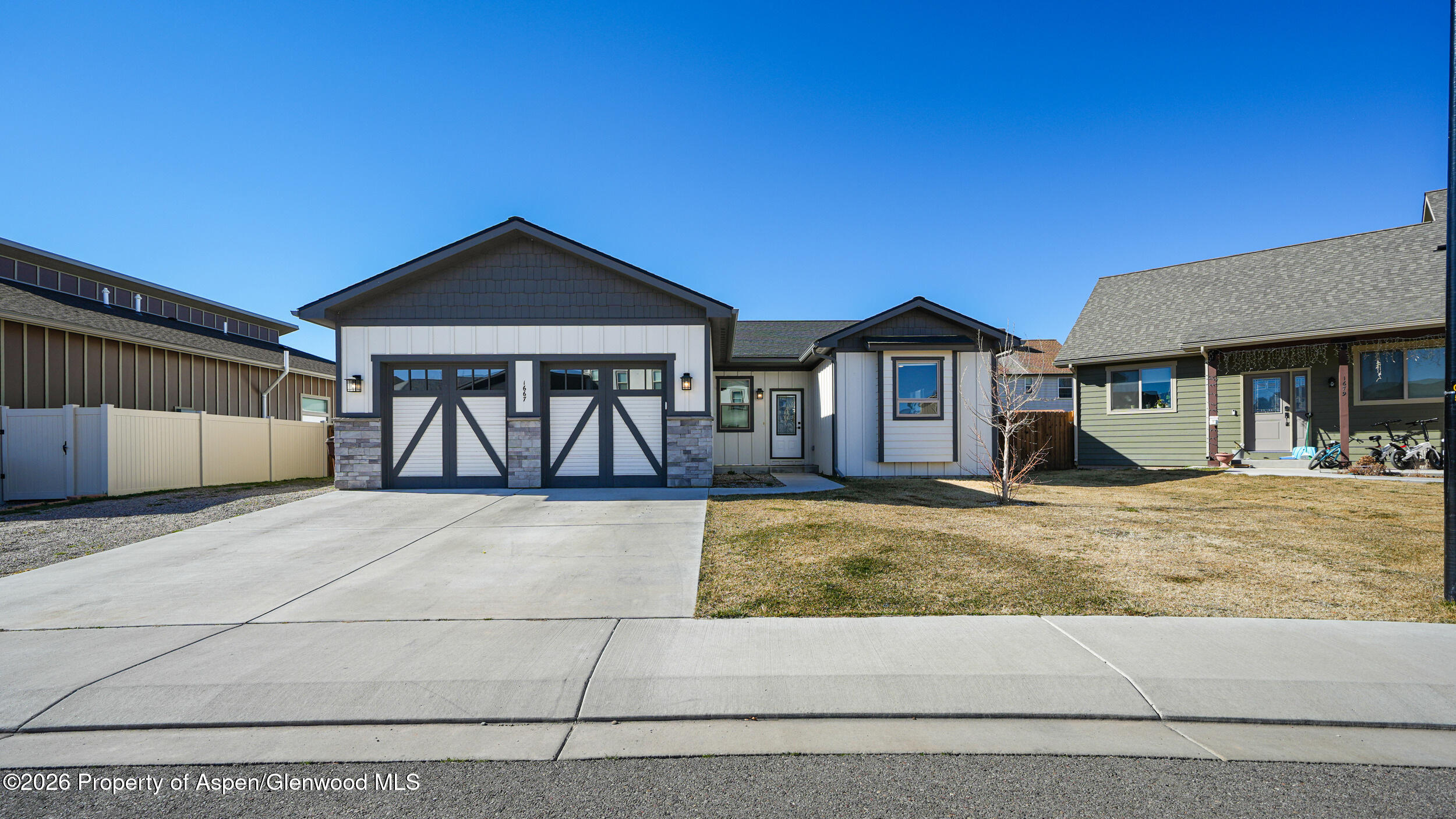 a view of a house with large windows and a table