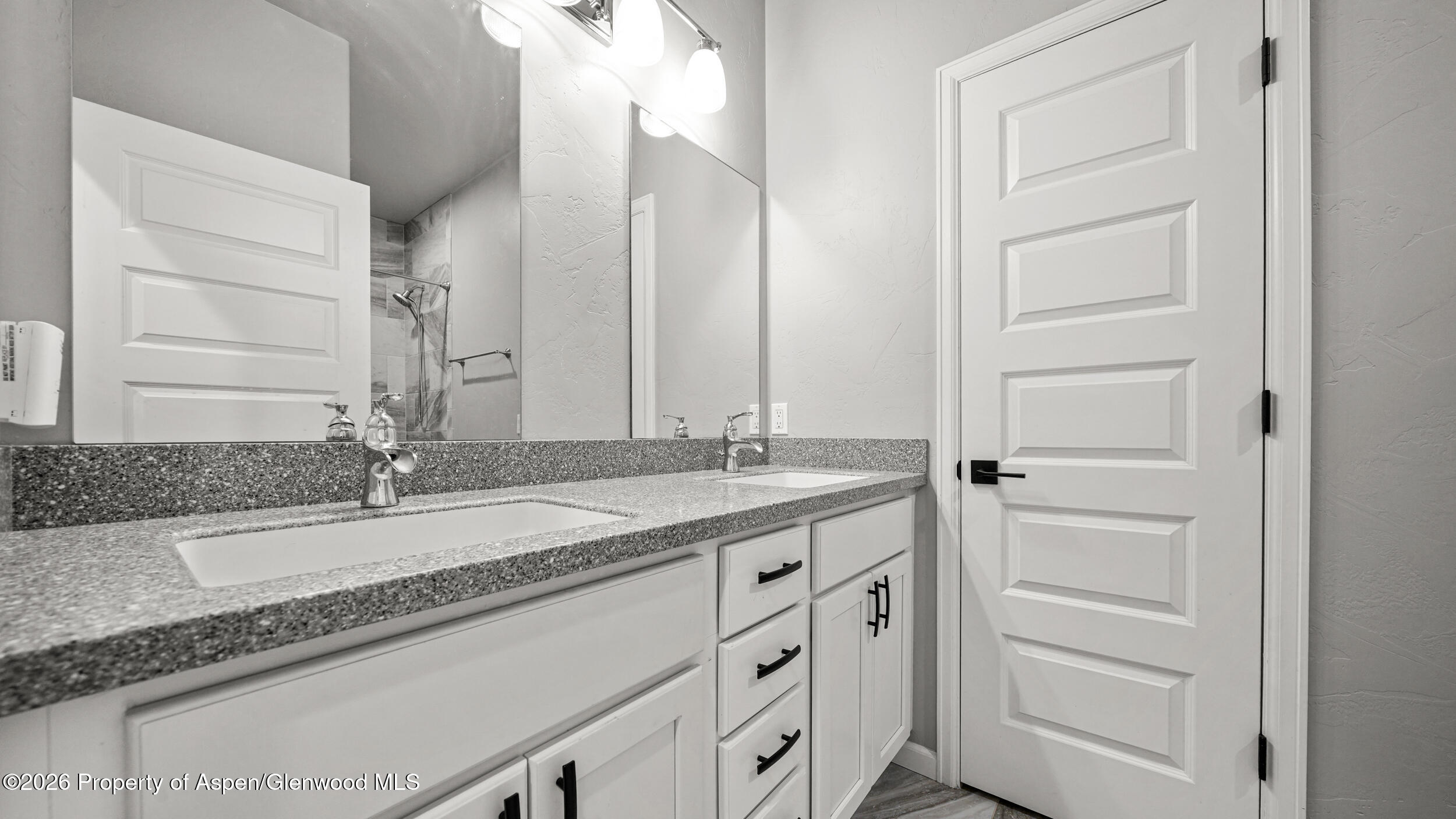 1667 Balsam Loop Rifle, CO 81650 - Photo 17 of 30 a bathroom with a granite countertop sink and a mirror