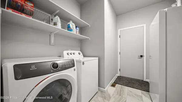 a utility room with dryer and washer