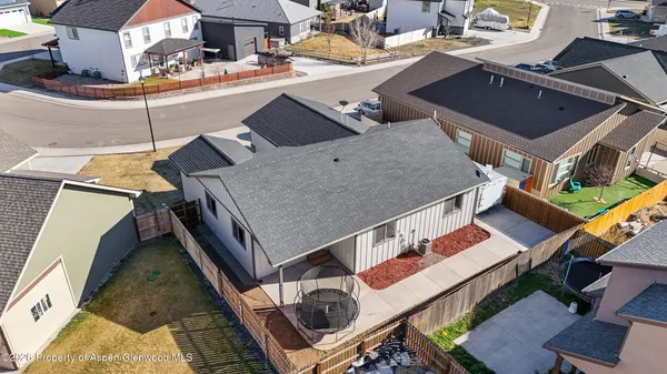 an aerial view of a house with roof deck