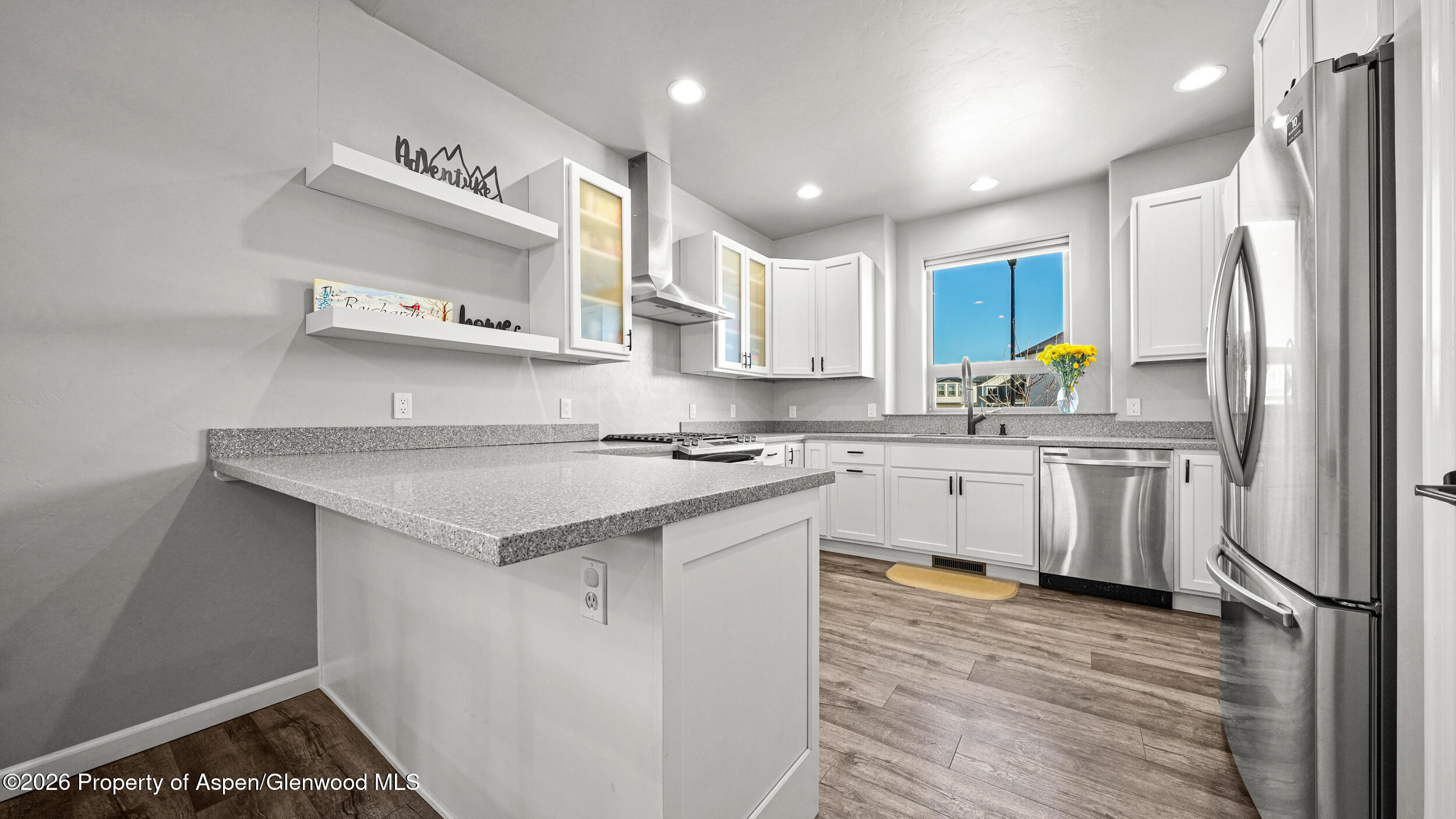 1667 Balsam Loop Rifle, CO 81650 - Photo 9 of 30 a kitchen with stainless steel appliances a sink stove and refrigerator