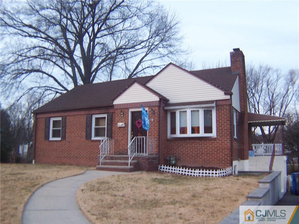 30 Oxford Road Colonia, NJ 07067 - Photo 1 of 17 a front view of a house with a garden