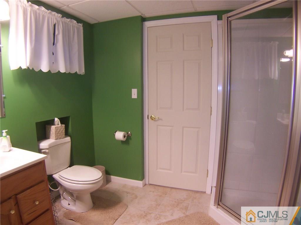 30 Oxford Road Colonia, NJ 07067 - Photo 14 of 17 a bathroom with a toilet a sink and mirror