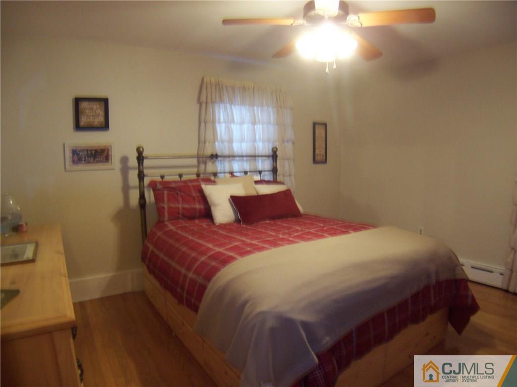 30 Oxford Road Colonia, NJ 07067 - Photo 7 of 17 a bedroom with a bed and window