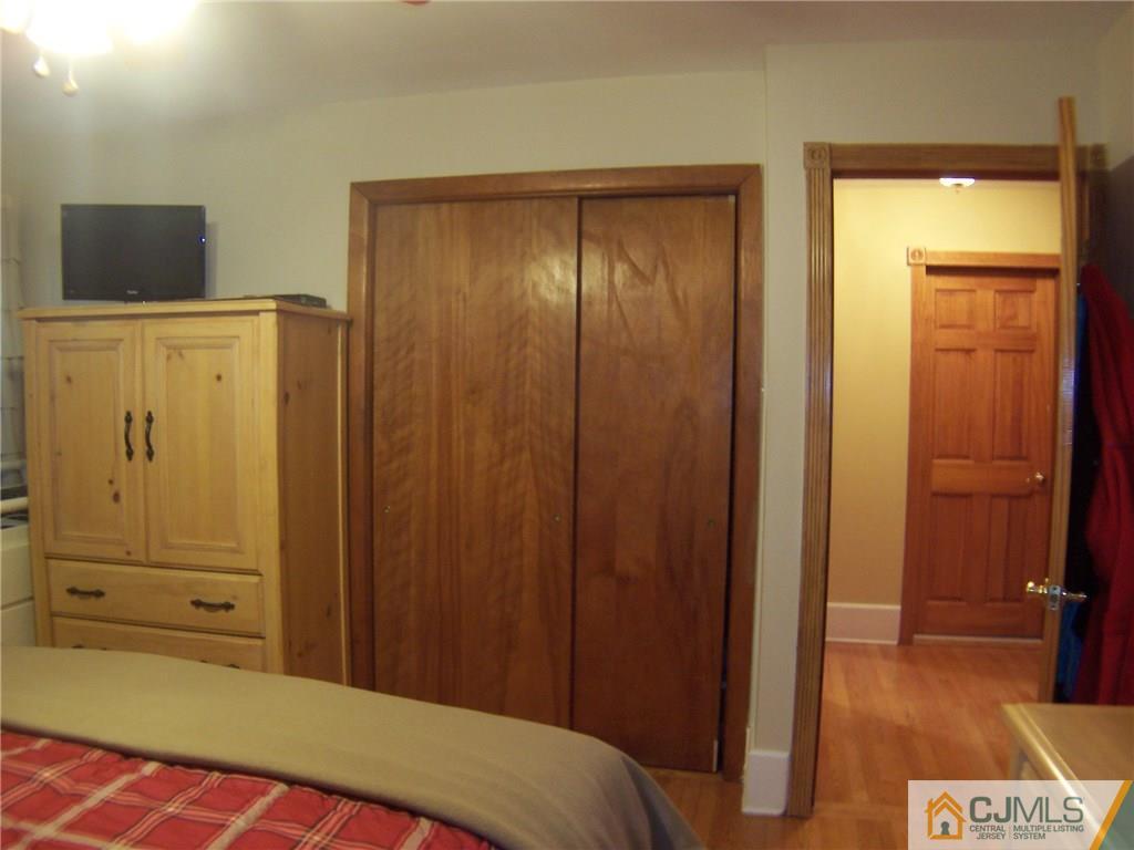 30 Oxford Road Colonia, NJ 07067 - Photo 8 of 17 a bedroom with a bed and wooden floor
