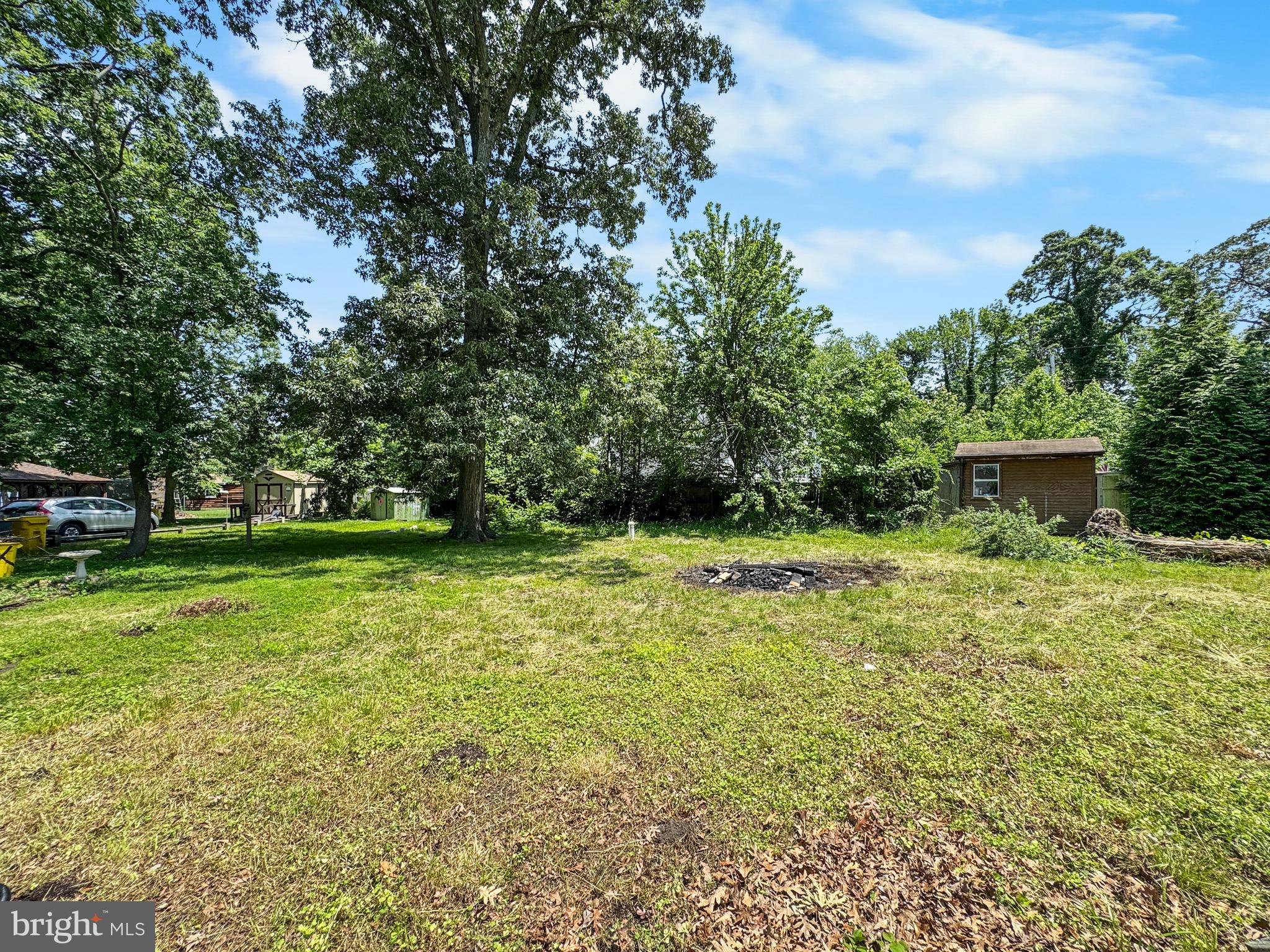 4725 Idlewilde Road Shady Side, MD 20764 - Photo 17 of 28 a view of a backyard with large trees
