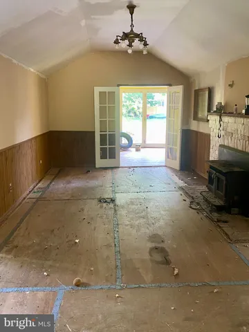 a living room with fireplace furniture and a window