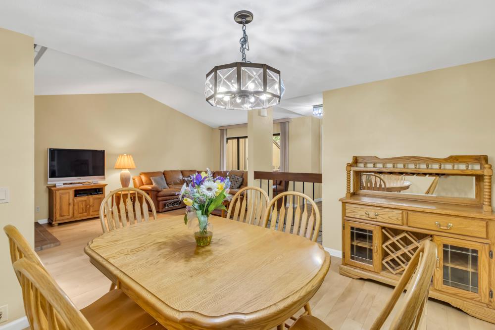 7025 Rancho Mirage Court Citrus Heights, CA 95621 - Photo 14 of 69 a dining room with furniture a chandelier and wooden floor
