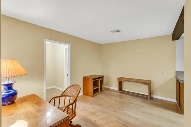 a bathroom with a sink vanity and a mirror