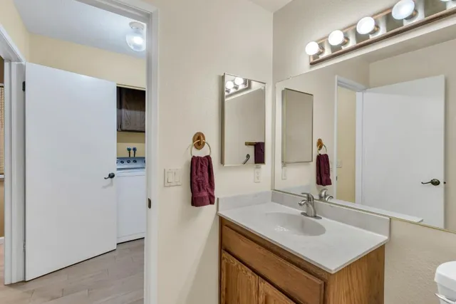 a kitchen with a sink a stove and cabinets