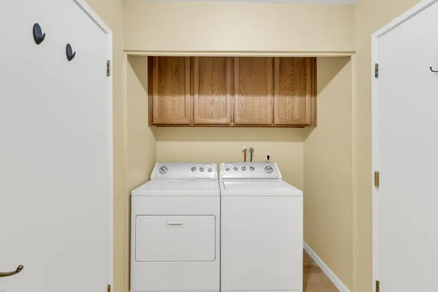 a large kitchen with kitchen island a stove a sink and a refrigerator