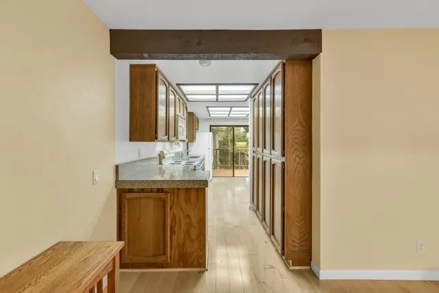 a kitchen with a stove a sink and a refrigerator