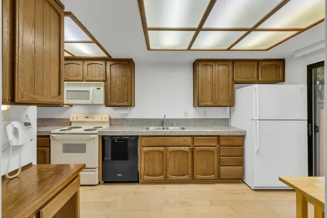 a view of entryway with wooden floor and stairs