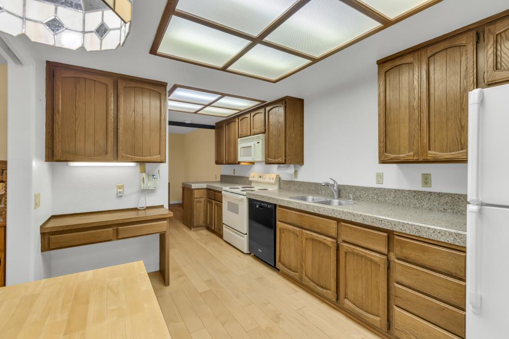 7025 Rancho Mirage Court Citrus Heights, CA 95621 - Photo 30 of 69 a kitchen with stainless steel appliances granite countertop sink stove and cabinets